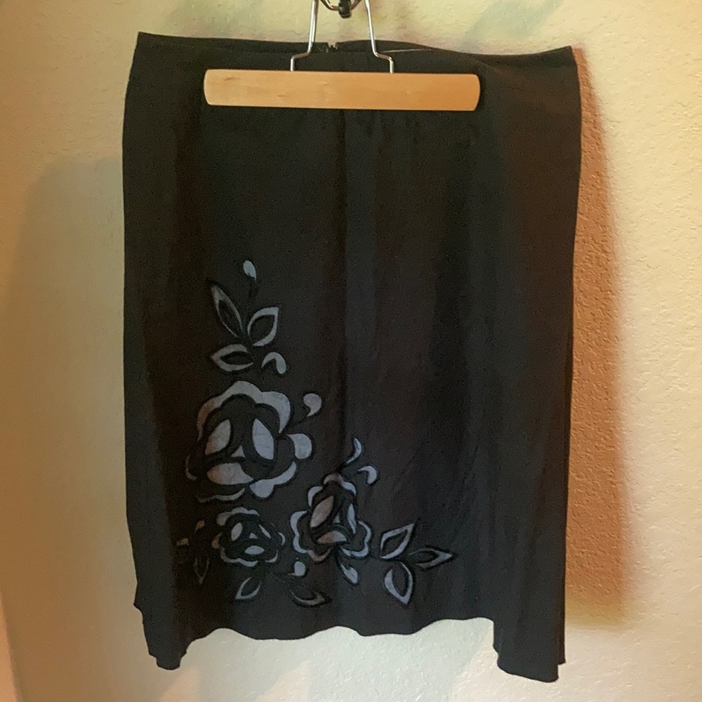 Black skirt with lace cut out flowers